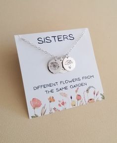 Sisters, different flowers from the same garden A meaningful necklace that represents the birth month of your sisters. Makes a special personalized keepsake gift. Flowers that will last forever ♥Solid disc charms are hand stamped in our studio with a beautiful flower bloom representing the birth month chosen. The circle charm is solid Sterling Silver, 22 gauge not flimsy or bendable and measures 15 mm in size. Charm are displayed from shimmering Sterling Silver chain in your choice of length. Lo Gift For Sister In Law, Sisters Necklace, Gift Flowers, Birth Flower Necklace, Meaningful Necklace, Flower Charm Necklace, Sister Jewelry, Sister Necklace, Gifts For Your Sister