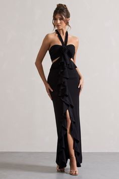 Powerful | Black Cut-Out Halter-Neck Maxi Dress With Flower & Ruffles Halter Off Shoulder Dress, Luxury Chic Halter Dress With Ruffles, Chic Halter Neck Maxi Dress With Ruffle Hem, Luxury Ruffled Halter Neck Dress, Black Floor-length Halter Dress For Night Out, Black Ruched Halter Neck Maxi Dress, Halter Long Dress, Halter Neck Maxi Dress, Sleek Bun