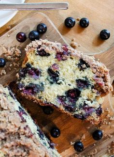 blueberry muffins cut in half on a cutting board