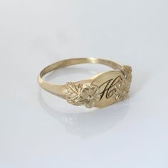 This vintage-inspired floral ring is a series of dainty flowers wrapped around your fingers. Handmade and polished, it is available in 14K gold. This item is engravable with text or monogram of your choice at no extra cost. The initals are engraved onto the ring and embedded in the 3D model for a flawless embossed finish. You may also request for writing on the inside! You may choose to customize this ring with different flowers or letters. Depending on the text used, the flowers may be rearrang Vintage Personalized Jewelry For Promise, Heirloom Birth Flower Jewelry, Gold Engraved Delicate Rings, Delicate Engraved Gold Rings, Delicate Gold Engraved Rings, Gold Flower Heirloom Jewelry, Heirloom Birth Flower Promise Ring, Heirloom Gold Flower Jewelry, Heirloom Birth Flower Jewelry For Anniversary