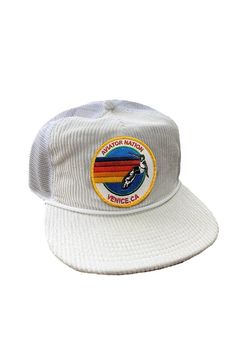 From Corduroy in the front to mesh in the back with a classic Aviator Nation patch, this hat has it all.All of our products go through an intense breaking-down process that gives them a vintage feel you'll love because it's broken in from day one of wearing it. All of our hats are adjustable! Retro White Hat With Logo Patch, White Retro Hat With Logo Patch, Vintage 5-panel Trucker Hat For Streetwear, Vintage Trucker Hat With Flat Brim For Streetwear, Vintage Flat Brim Trucker Hat For Streetwear, Vintage White Trucker Hat With Curved Brim, Retro Trucker Hat With Logo Patch, Retro Snapback Hat With Embroidered Patch, Retro Adjustable Hat With Embroidered Patch