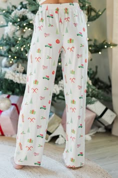 Plan on staying in a lot this holiday season? Or at least plan on staying with family and friends for Christmas eve? Then these pajamas are perfect for you! They are so cute and totally comfy! These classic pjs are going to have you feeling festive and fun this holiday season! Top Collared neckline Button down front closure Long sleeves Red piping Christmas pattern Generous stretch Bottoms Elastic waist Christmas pattern Generous stretch Baileigh is wearing the small. Cute Christmas Pjs, Plaid Christmas Pajamas, Christmas Pajama Bottoms, Adult Christmas Pajamas, Christmas Pants, Pjs Christmas, Bamboo Pajamas, Christmas Leggings, Christmas Clothes