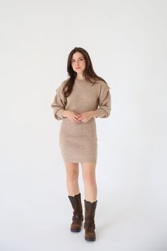 A ribbed knit mini dress with the following features: Round neckline. Bishop sleeves with ruffle detailing. Loose fit. Model Info: Height: 5 ft 8 in wearing Size S. Fall Mini Dress With Ruffles, Fall Ribbed Mini Bodycon Dress, Fall Ribbed Mini Dress, Knit Mini Dress For Fall, Stretch Mini Dress With Ruffles For Winter, Winter Ribbed Mini Dress For Date Night, Ribbed Mini Bodycon Dress For Fall, Winter Date Night Ribbed Mini Dress, Casual Ruffle Sleeve Mini Dress For Fall