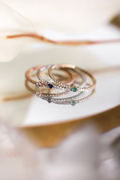 The Pavé Birthstone Stacker is a take on the CTWF classic Birthstone Stacker with a diamond twist. Stack your birthstone, anniversary stone, or a colored stone of your choosing along the pavé diamond band for a hint of sparkle and color. Rose Gold Stackable Rings With Birthstones And Diamonds, Rose Gold Diamond Stackable Rings With Birthstone, Diamond White Birthstone Jewelry For Promise, Diamond White Jewelry With Birthstone For Promise, White Birthstone Jewelry For Promise, Round Emerald Ring With Pave Diamond Setting, Diamond Emerald Birthstone Ring For Promise, Cubic Zirconia Diamond Ring For May Birthstone, Promise Emerald Ring With Diamond And Birthstone