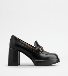 Characterized by a leather platform outsole, these loafers with block heel come with the metal double T accessory. Crafted in semi-shiny leather, they interpret a timeless informal elegance. Italian Luxury, Heeled Loafers, Bags And Accessories, Luxury Shoes, Trainers Women, Black Heels, Leather Heels, Block Heels, Timeless Elegance