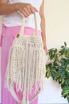 Boho fringe handbag. Spring Bohemian Woven Bucket Bag, White Fringed Shoulder Bag For Beach, Spring Bohemian Bucket Bag With Braided Handles, Bohemian Spring Crochet Bucket Bag, Bohemian Spring Bucket Bag Tote, Bohemian Bucket Beach Bag, Bohemian Spring Tote Bucket Bag, Spring Bohemian Bucket Bag, Summer Festival Bucket Shoulder Bag