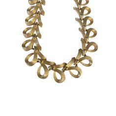 This vintage 1970's Sarah Coventry signed necklace boasts an ornate link design and is made from gold-tone metal. The 17.5 inch long necklace features a brushed finish and a brutalist style chain, perfect for making a statement. This piece is marked with the Sarah Coventry name and is in great condition, though there may be some signs of wear from age and storage. A must-have for any jewelry collection, this necklace has been well cared for and measures approximately 0.75 inches in width. 1970 Jewelry, Brutalist Jewelry, Gemstone Choker Necklace, Metal Choker, Link Design, Gold Choker Necklace, Sarah Coventry, Gold Choker, Gold Tone Necklace