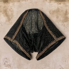 This gorgeous, delicately embroidered wide-sleeve shoulder cover is a stunning accessory to compliment your little black dress. Created to add a touch of sophisticated bohemian glamor as an alternative to a basic shoulder cover for summer evenings or events. This comfortable, lightweight, and timeless accessory is sustainably made with vintage silk fabric sourced for its beauty and uniqueness. Party Dupatta With Floral Embroidery And Cape Sleeves, Embroidered Kaftan With Cape Sleeves For Party, Party Kaftan With Embroidered Cape Sleeves, Summer Evening Embroidered Kaftan, Silk Kaftan With Intricate Embroidery For Party, Party Silk Kaftan With Sheer Dupatta, Elegant Silk Kaftan With Sheer Dupatta, Festival Silk Kaftan With Traditional Drape, Bohemian Festival Kaftan With Dupatta