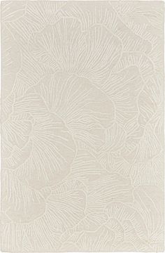 a white rug with an intricate design on the front and back side, in shades of beige