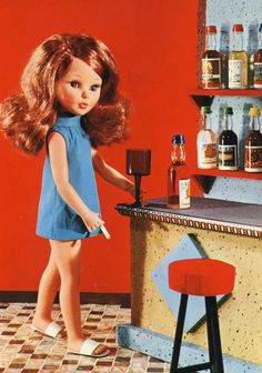 a doll standing in front of a bar with bottles on the shelves and stools