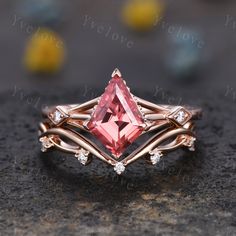 a pink tourmaline ring with diamond accents