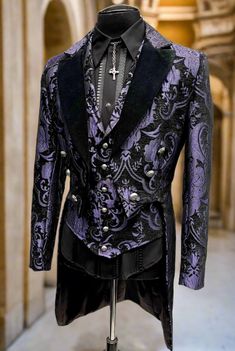 A formal Victorian coat with tails. Great for special occasions, formal events, or when you want to stand out from the crowd. Beautiful purple and black tapestry fabric with luxurious black velvet lapels. Fully lined in rich black satin. Six ornate metal buttons decorate the front and two at the waist in back. Three smaller metal buttons are at each cuff. Comes in sizes Small-3X. I love this one!! Measurements: Small - Chest 40" Waist 30-34" Medium - 42-44" Waist 32-38" Large - Chest 46" Waist 3 Purple Velvet Suit Men, Halloween Wedding Tuxedo, Purple And Black Suits For Men, Black And Purple Suits For Men, Purple Royal Outfit, Dark Purple Suits For Men, Gothic Suits, Purple Wedding Suit, Black Purple Wedding