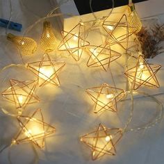 string lights are arranged in the shape of stars