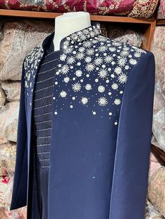 Midnight blue exclusive embellished with intricate pearl, stone, zari and cutdana work, this sherwani speaks volume of class. Commingled with blue color kurta for the complete ensemble. This jacket sherwani is a unique style that we loved. Even the color is fresh and looks royal. Size: 42,44 Occasion: Wedding Ceremony or Reception WASH CARE INSTRUCTIONS - Please Dry clean only when it is applicable. Slight color variation is possible due to digital photography. Ready to Ship! Cutdana Work, Bollywood Theme, Pearl Stone, Indo Western, Designer Clothes For Men, Digital Photography, Midnight Blue, Wedding Ceremony, Unique Style