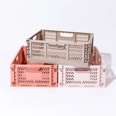 two crates sitting side by side on top of each other in front of a white background