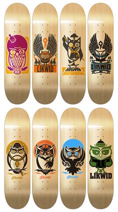 six skateboards with different designs on them, each featuring an owl and other animals