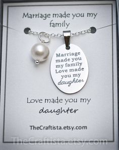 a necklace that says marriage made you my family love made you my daughter with a pearl on it