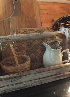 an old wooden box filled with items like baskets and other things to put in it