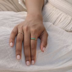 Featuring a row of rich emeralds, this ring is a wearable piece of art. Exquisite as a pop of color on it's own, or as a complimentary piece to your ring stack, our emerald demi band makes the perfect addition to your jewelry collection. Shop our full Demi Band Collection and discover all the color options on this exquisite design. Classic Green Emerald Cut Stackable Rings, Classic Green Emerald Stackable Rings, Classic Green Emerald-cut Stackable Rings, Green Half Eternity Stackable Rings Fine Jewelry, Fine Jewelry Green Emerald-cut Stackable Rings, Fine Jewelry Green Emerald Cut Stackable Rings, Emerald Cut Green Stackable Rings Fine Jewelry, Green Emerald Cut Stackable Rings, Fine Jewelry Green Emerald Half Eternity Ring