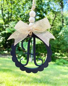 a hanging ornament with a bow on it