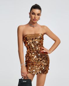 Get ready to shine and turn heads in our Open Back Sequins Embellished Mini Dress! This stunning dress features a strapless design and is adorned with sparkling sequins throughout. Perfect for a night out or special event, this dress will make you stand out and feel confident. Our Style No.ZNSBA780 Bead Piece Height - 68.9"/175cm Bust - 34.6"/88cm Waist - 25.6"/65cm Hips - 36.6"/93cm and wears size S About Wholesale/Dropshipping, please contact us! Note: Colour may vary due to lighting on images Glamorous Embellished Sequin Club Dress, Gold Sequined Mini Dress For Evening Wear, Glamorous Embellished Sequin Dress For Club, Gold Mini Dress With Contrast Sequin For Party, Gold Party Mini Dress With Contrast Sequin, Glamorous Strapless Dress For Prom Season, Strapless Mini Dress For Prom Party Season, Embellished Sequin Mini Dress For Party, Embellished Mini-length Sequin Dress For Party