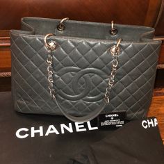 100% Authentic Chanel Quilted Dark Grey Chanel Bag With Silver Hardware Barely Used And In Great Condition - Comes With Box And Dust-Bag Height -10” Width- 16” Large Luxury Bags With Removable Pouch, Luxury Large Shoulder Bag With Top Carry Handle, Luxury Large Shoulder Bag With Removable Pouch, Large Luxury Satchel, Large Black Luxury Bag, Large Luxury Black Bag, High-end Luxury Tote Bag, Everyday Luxury Large Capacity Rectangular Shoulder Bag, Designer Formal Bags With Large Capacity