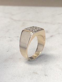 a gold ring sitting on top of a white counter