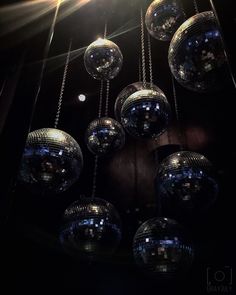 disco balls are hanging from the ceiling