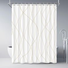 a white shower curtain next to a bathtub with a faucet in it