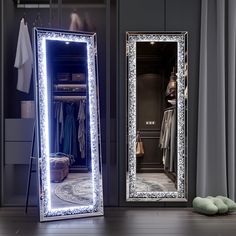 a large mirror sitting on top of a wooden floor next to a pair of shoes