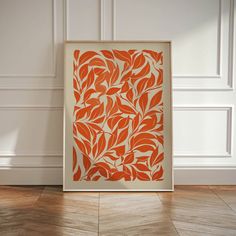 an orange and white art piece on the floor