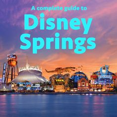 disney springs with the words, a complete guide to disney springs in blue and pink