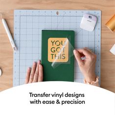 a person cutting out a card with scissors and glue on top of it that says, you got this transferer vinyl designs with ease & precision