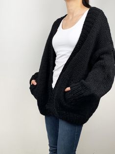 "New design for this winter! Oversize cardigan gives you cozy feel and stylelish looking! Feastures: * open front cardigan with side pockets * oversize looking * drop-shoulder sleeves * 70% wool / 30% acrylic chunky blended yarn - soft and no itchy at all Size: S(us 0-4) M(us 6-8) L(us 10-12)XL(14-16). Pls. choose size and color options. Size Measurements: S: chest 47\"(120cm), length -26\"(65cm) M: chest - 51\"(130cm) length - 27\" (68cm) L: chest 55\"(140cm), length- 28\"(70cm) XL: chest 59\"( Chunky Black Cardigan Outfit, Black Chunky Cardigan, Black Knitted Cardigan Outfit, Oversized Cardigan With Pockets For Cold Weather, Oversized Knitted Sweater Coat For Cold Weather, Relaxed Fit Chunky Knit Sweater Coat For Winter, Oversized Cozy Cardigan With Pockets, Cozy Oversized Cardigan With Pockets, Oversized Knitted Cardigan For Everyday