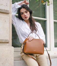 Savor the bittersweet elegance of our Fleuron bag in caramel color. This warm and versatile shade complements any outfit perfectly. Made in Italy from grained calf leather, this bag features a beige interior and golden details for a luxurious finish. Brown Saffiano Leather Top Handle Satchel, Brown Saffiano Leather Satchel With Top Handle, Brown Epsom Leather Top Handle Satchel, Brown Epsom Leather Satchel With Top Handle, Brown Saffiano Leather Satchel With Detachable Handle, Timeless Cognac Shoulder Bag With Detachable Handle, Timeless Cognac Satchel With Detachable Handle, Elegant Brown Epsom Leather Satchel, Brown Timeless Bag For Everyday Luxury