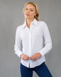 The Bubble Blouse offers women lightweight, breathable, easy-care comfort in a sophisticated style. A looser fit blouse with a stylish collar and 3-button cuff. Compact, light, and soft, with two-way stretch. Made with Renew Bubble fabric, this blouse has a unique mesh texture, delicate feel, comfortable stretch and is fast drying. Feels like a veil on the skin. All Luxeire garments require no dry-cleaning with natural wrinkle release. Colors: black, white Ultra lightweight, breathable, thermore Formal Solid Blouse With Placket, Formal Blouse With Placket, Solid Spread Collar Blouse For Office, Office Blouse With Spread Collar In Solid Color, Fitted Solid Color Blouse With Placket, Classic Collared Blouse For Office, Classic Collared Office Blouse, Business Blouse With Spread Collar, Classic Spread Collar Blouse For Office