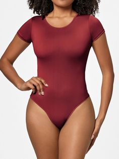 Features: Basic style Sheer: Opaque Stretch: Slightly stretchy Material composition: 79.3% polyester, 20.7% spandex Care instructions: Machine wash cold. Tumble dry low. Imported Size US Top Length Bust Waist Hip Shoulder Sleeve Length S 2/4 26.2 26.8 22 25.2 12.6 4.9 M 6 26.8 28.3 23.6 26.8 13.4 5.3 L 8 27.4 29.9 25.2 28.3 14.2 5.7 XL 10 28 31.5 26.8 29.9 15 6.1 2XL 12 28.5 33.1 28.3 31.5 15.7 6.5 3XL 14 29.1 34.6 29.9 33.1 16.5 6.9 Basic Solid Color Elastane Bodysuit, Solid Color Elastane One-piece Bodysuit, High Stretch Solid Color One-piece Leotard, Solid One-piece Smoothing Leotard, Smoothing One-piece Leotard, Red Stretch Nylon Bodysuit, Solid Stretch Smoothing Bodysuit, Solid One-piece Nylon Leotard, High Stretch Short Sleeve Unitard