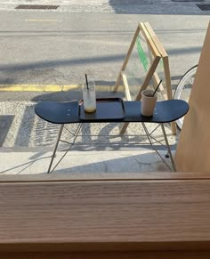 a skateboard sitting on top of a wooden table