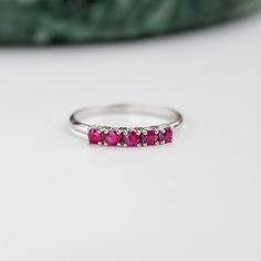 A stacking 5 stone ruby ring in 14K solid rose gold. It is ideal for anniversary gift for women or for an alternative wedding band. This ruby cluster ring can be also used as a Christmas Gift. Also, ruby is the July birthstone. 100% handcrafted with love! PRODUCT DETAILS ● Material : 14K solid gold - white gold - rose gold ● Gemstones: 5 Rubies natural ● Ruby's Diameter: 2.5mm ● Rubies Weight: 0.41ct ● Gemstones shape: Round/ Brilliant cut RING SIZING For General Reference: ● we use standard US Fine Jewelry Ruby Half Eternity Ring For Anniversary, Stackable Ruby Ring For Formal Occasions, Anniversary Ruby Half Eternity Ring, Stackable White Gold Ruby Ring, White Gold Ruby Ring With Half Eternity For Promise, White Gold Ruby Half Eternity Promise Ring, White Gold Three Stone Ruby Ring For Wedding, Formal Stackable Ruby Ring In Sterling Silver, Classic Stackable Ruby Ring For Anniversary