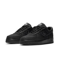 The Nike Stussy x Air Force 1 Low 'Triple Black' is a sleek and stylish sneaker that's perfect for everyday wear. With its breathable hemp construction, this sneaker is comfortable and easy to wear, while the split-embroidered Swoosh and Stussy's double S logo add a touch of style. The interlocking letters on the heel tab and tongue tag are also a nice touch, while the World Tour iconography on the tongue tag is a nice finishing touch. Nike High-top Sneakers With Textured Sole For Streetwear, Carbon Color Lace-up Sneakers With Boost Midsole, Nike Sporty Custom Sneakers With Textured Sole, Nike Custom Sneakers With Textured Sole, Nike Custom Sneakers With Textured Sole In Sporty Style, Nike Custom Sneakers With Textured Sole, Sporty Style, Modern Nike Air Force 1 Lace-up With Branded Insole, Nike Sporty Sneakers With Textured Sole, Nike Sneakers With Textured Sole For Light Sports