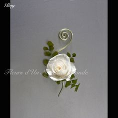 a single white rose with green leaves on a gray background and the word love is written in cursive writing