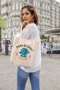 "15.75\"h x 15.25\"w, handle length of 21.5\" 100% cotton sheeting Lightweight and compact" Eco-friendly Large Capacity Canvas Bag, Eco-friendly Cotton Travel Bag, Beige Reusable Tote Canvas Bag, Eco-friendly Ink Canvas Tote Bag For Travel, Recyclable Tote Bag For Everyday Use, Eco-friendly Everyday Shoulder Bag, Beige Recyclable Bag For Everyday, Eco-friendly Everyday Canvas Gift Bag, Beige Recyclable Bags For Daily Use