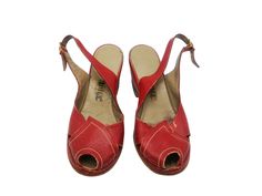 Vintage 1940s Red Leather Wedge Sandals, Women's WWII Era Shoes, Approx. Size 36 EU. Step into a piece of history with these charming 1940s French vintage wedge sandals. Crafted during the WWII era, these sandals feature a striking dark red leather, an open-toe design, and delicate perforated detailing with stitching. The wedge heel stands at 5.5 cm (2 1/4"), offering a blend of style and comfort. Brand: Sodec Deposé These exquisite vintage wedge sandals are perfect for collectors or those who a Vintage Open Heel Wedge Sandals For Summer, Vintage Closed Toe Leather Wedge Sandals, Vintage Leather Closed Toe Wedge Sandals, Retro High Heel Wedge Sandals, Vintage Wooden Wedge Heels, Retro Red Sandals With Round Toe, Vintage Closed Toe Sandals, Vintage Leather Wedge Sandals, Leather Wedge Sandals