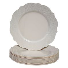 a stack of white plates sitting on top of each other