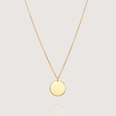 The Chiara necklace is a light gold round disc necklace that you just NEED. Wheather you wear it alone or stacked, with your another necklace or bare alone- it's perfect. Add a personal touch to your Chiara necklace with an engraved portrait of a loved one on one side and their name engraved on the opposite side. If you can dream it- we can make it happen. All features can be customized! Talk to us, we love making custom designs. Our jewelry is carefully handmade in our atelier To order by phone call +972(0)722991000 White Gold Round Medallion Necklace, Tarnish Resistant, Minimalist Round Pendant Coin Necklace As Gift, Everyday Round Medallion Necklace Tarnish Resistant, Everyday Round Tarnish Resistant Medallion Necklace, Everyday Round Tarnish-resistant Medallion Necklace, White Gold Necklace With Round Disc Coin Pendant, Yellow Gold Coin Pendant Necklace, Yellow Gold Sterling Silver Round Coin Necklace, Yellow Gold Round Disc Necklace For Everyday