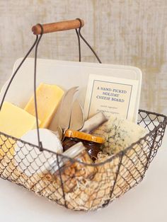 a basket filled with different types of cheese