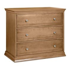 a wooden dresser with three drawers on it