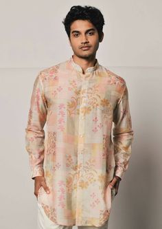 Patchwork print shirt style mal cotton kurta featuring a mandarin collar, cuffed sleeves and a curved hemline. This is a 2 piece set complete with a cream trouser style cotton pajama. Traditional Spring Kurta With Set-in Sleeves, Cotton Bandhgala With Printed Motifs For Festive Occasions, Cotton Bandhgala Straight Kurta For Transitional Season, Spring Festive Cotton Bandhgala, Traditional Cotton Silk Kurta With Set-in Sleeves, Cotton Silk Straight Kurta With Set-in Sleeves, Cotton Silk Kurta With Set-in Sleeves, Cotton Bandhgala With Printed Motifs For Eid, Transitional Long Sleeve Cotton Sherwani