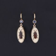 Add a touch of intrigue to any ensemble with these unique insect earrings! To create these earrings, our jeweler carefully cut antique shibayama game pieces (circa 1880) into an oval shape, mounted them in 14k gold, and added 14k ear wires and sapphire surmounts. Each earring measures 1 inch from the top of the ear wire to bottom by 0.3 inches wide, and they are in excellent condition. We have many other fantastic offerings of period fine jewelry posted on our Etsy store, so please consider brow Ear Earrings, Jewelry Post, Antique Earrings, Sapphire Earrings, Game Pieces, Vintage Jewels, Artistic Jewelry, Antique Shops, Ear Jewelry