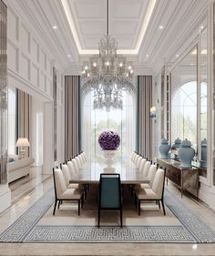 an elegant dining room with chandelier and large table surrounded by white upholstered chairs